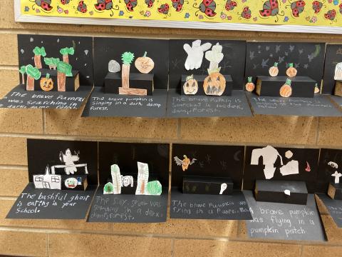 Second Grade Student work:  Halloween pop-up stories with headstones, pumpkins, bats, ghosts and trees