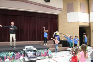 March, Mr. Cornwall leading the students to dance