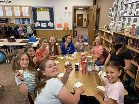 Fifth grade students making butter