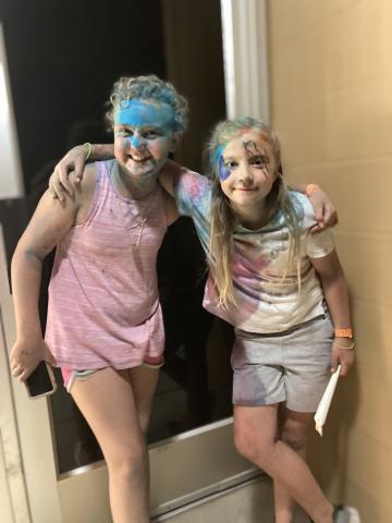 Two students covered in chalk after the chalk fight