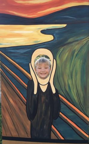 A student in a photo prop of Edward Munch's Scream