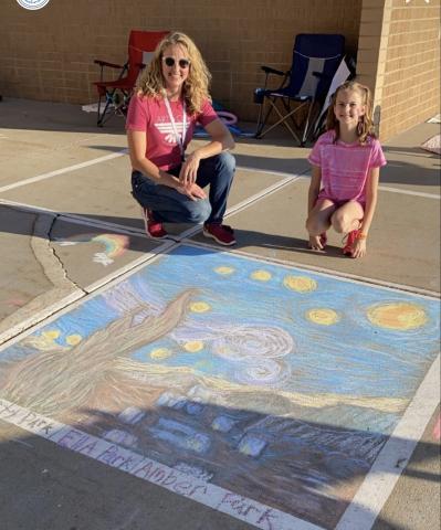 Mrs. Park and a student next to their depiction of Van Gough's Starry Night