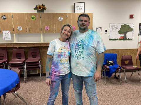 Mrs. Bailey and Mr. Warner after the chalk fight, covered in colored chalk