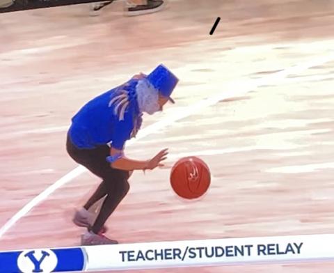 Teacher and student relay--student dribbling the ball