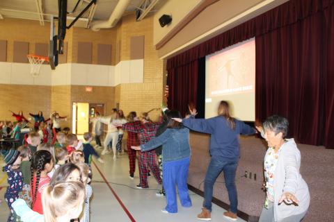 teachers dancing with Just Dance and the students