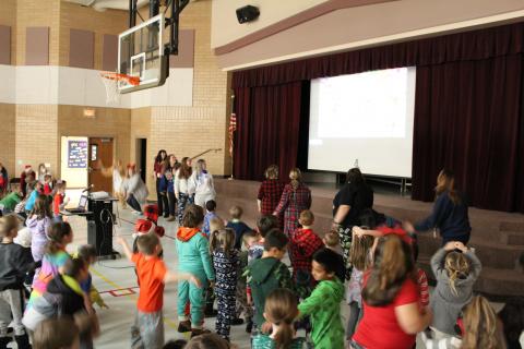 teachers dancing with Just Dance and the students
