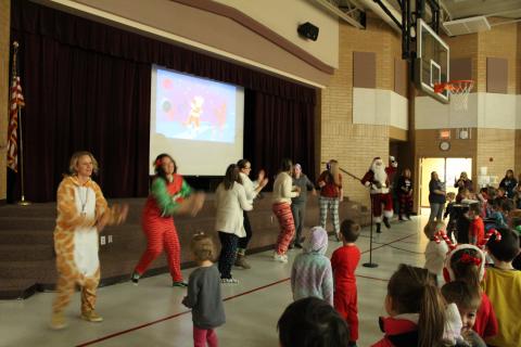 Santa teachers and students are dancing to Just Dance 