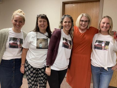 Faculty and staff wearing Lisa Muirbrook t-shirts and Lisa Muirbrook