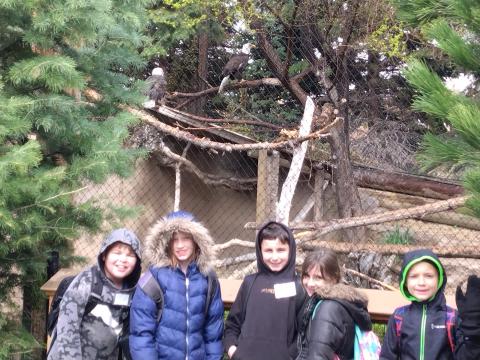 Art City Eagle students posing with the bald eagles 