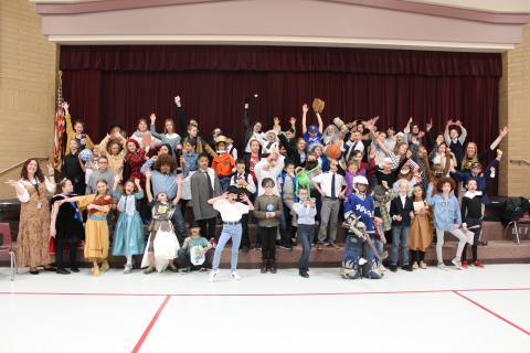 Goofy poses of the whole 5th grade dressed up as famous and important people in America
