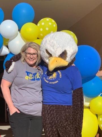 Mrs. Muirbrook with the Art City Eagle Mascot
