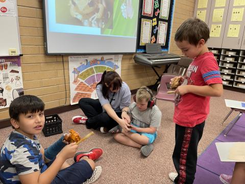 Students playing the Coqui frog