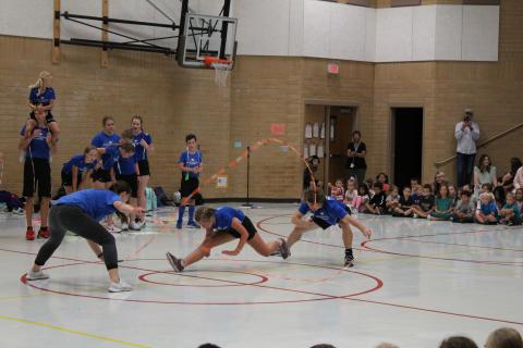 Just Jumpin team jumping rope while doing the splits