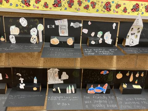 Second Grade Student work:  Halloween pop-up stories with headstones, pumpkins, bats, ghosts and trees