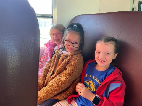 Second grade students on the bus