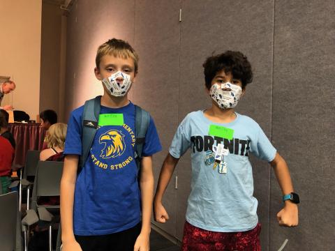 Two Art City Student Council Students with Art City Stickers on their face
