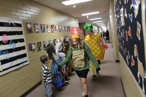 Students in costume walking in the parade