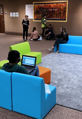 Students doing school work in the Lobby of Art City Elementary