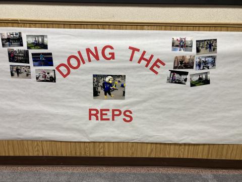 Banner with students pictures, in the school lobby of LIFT Students recognized for setting goals