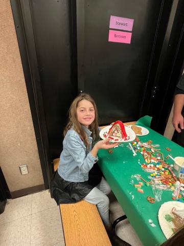 A Student decorating their Gingerbread creation. 