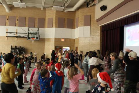 Teachers and Students dancing to the Crazy Santa