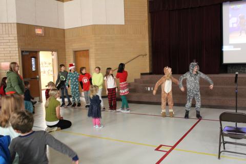 Fifth grade leading the Gingerbread dance 
