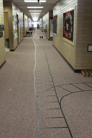 A Hallway with rail road Tracks. 