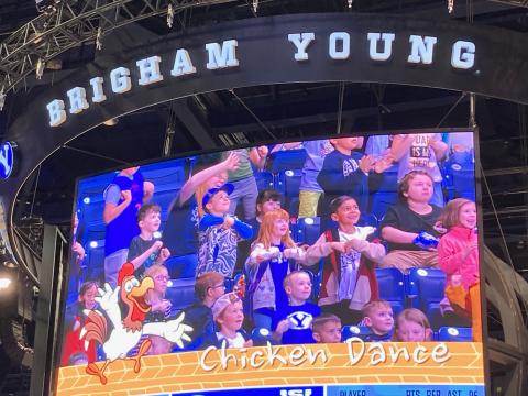 Students featured on the Jumbo Tron during the Chicken Dance 