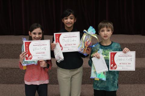 Three Award of Merit Students with certificates and goodie bags 