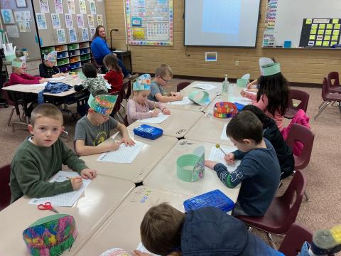 First grade students creating 100 Day pictures