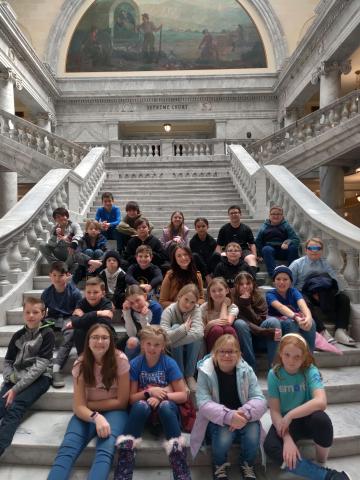 Mrs. Bertrums Students on the steps inside the State