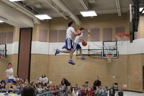 Two members of the Dunk team soaring through the air