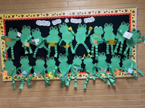 Bulletin board: frogs reading their favorite books