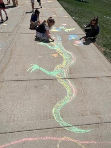 a student drawing a lizard