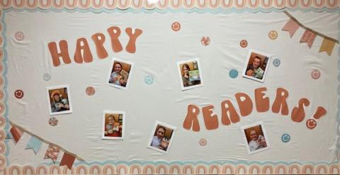 Happy Readers bulletin board with pictures of seven 5th grade students and their favorite book. 