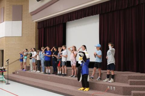 Student Council signing and leading students in singing the school song