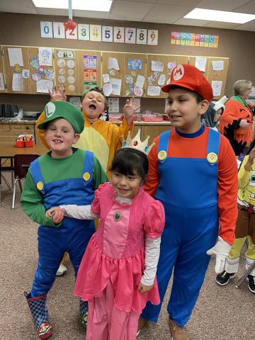 Luigi, Princess Peach, and Mario -- students in costume