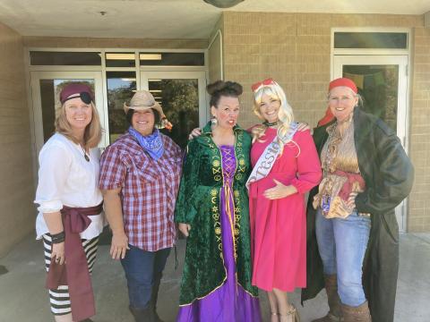 two Pirates, a cowgirl, Winnifred Sanderson, and Barbie--Planning time Technicians in costume.