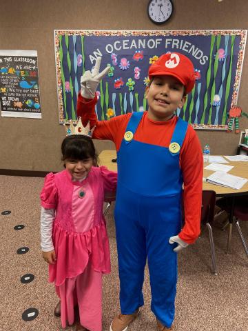 Princess Peach and Mario -- students in costume