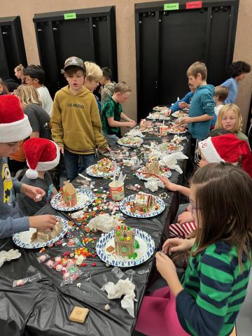 4th Grade students making their Gingerbread houses