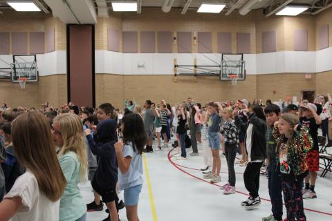 Students dancing, showing strong muscles