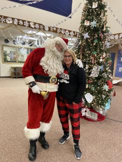 Mrs. Muirbrook with Santa Claus