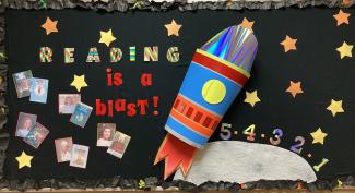 Library Bulletin board with teachers and their favorite books