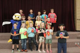 Perfect attendance Students with ACE the Eagle, holding water bottles