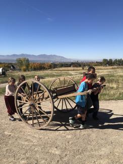 Fourth grade students pulling a handcart