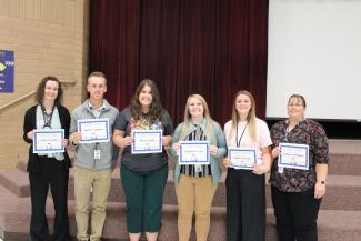 Six of the nine Staff members that received Staff of the month.