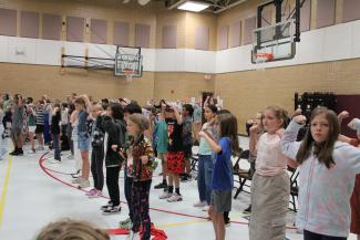 Students dancing, showing strong muscles